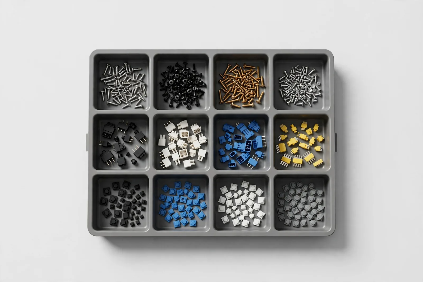 A tray of small spare parts and screws